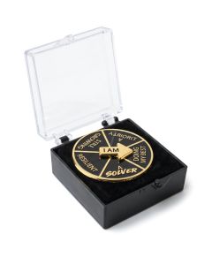 Spinning pin badge seen low from the side in an open box, showing the arrow's height and box depth, with print example
